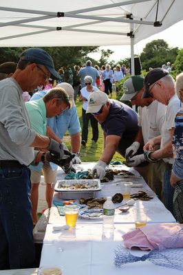 Community Picnic
The Mattapoisett Land Trust held its annual community picnic on August 3 at the Munro Preserve, complete with oyster service. Taking first place for best centerpiece was Table 29 with its Barbie theme. The Whale, at Table 1, was runner-up, and the Bird table (27) was third. Seth Asser and Gary Brown provided live music for the BYOB event. Photos by Mick Colageo
