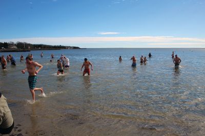 Mattapoisett Polar Plunge
New Year’s Day 2023 was bright and balmy when over 100 “plungers” ran, walked, hopped and slid into the freezing waters at Mattapoisett Town Beach. The event was hosted by an ad hoc group collecting donations for those battling cancer. The group has been successful in their efforts to help offset the unseen costs associated with a cancer diagnosis impacting local families. Heather Bichsel of the group said that this year they collected approximately $2,500, monies that will be given to a local family as wel
