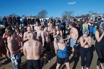 Freezin’ for a Reason Polar Plunge
It takes a certain type of person to jump into the cold ocean on New Year’s morning. Behold, the locals who fit that description as they enjoy a frosty January 1st at Mattapoisett Town Beach for the annual Freezin’ for a Reason Polar Plunge! Hundreds lined the beach to take the plunge, with bundled spectators watching from the sidelines and cheering as the plungers charged ahead screaming and shrieking with exhilaration. Proceeds from the plunge benefit locals battling cancer. Photos by Colin Veitch
