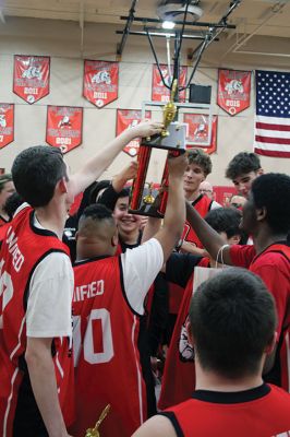 Old Rochester Regional Unified Basketball Team
The Old Rochester Regional Unified Basketball Team dominated Tri-Town Fire and Police to the delight of a packed ORR gymnasium on November 21. ORR seniors Traeh Carrington, John Butler and Jake Newton were recognized. Police chiefs Jason King (Mattapoisett), Robert Small (Rochester) and Richard Nighelli (Marion) presented $200 each from their respective departments to ORR’s Unified sports program, and nearly $2,700 was raised in ticket, T-shirt and concession sales. Photos by Mick Colageo
