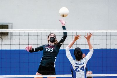 Old Rochester Regional High School Girls Volleyball
Senior co-captain Kailee Rodrigues sets the ball for her hitters, senior co-captain Meg Horan (11) and junior Maggie Brogioli (23), during the Old Rochester Regional High School girls volleyball team’s victory on Monday night at Fairhaven. The undefeated Bulldogs (11-0) open the South Coast Conference playoffs on Friday, April 30, on their home court in Mattapoisett. Photo by Ryan Feeney
