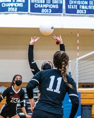 Old Rochester Regional High School Girls Volleyball
Senior co-captain Kailee Rodrigues sets the ball for her hitters, senior co-captain Meg Horan (11) and junior Maggie Brogioli (23), during the Old Rochester Regional High School girls volleyball team’s victory on Monday night at Fairhaven. The undefeated Bulldogs (11-0) open the South Coast Conference playoffs on Friday, April 30, on their home court in Mattapoisett. Photo by Ryan Feeney
