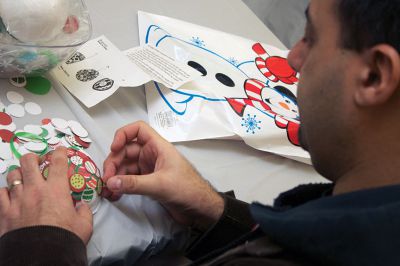 Holiday Ornaments
Mark Tavares of Mattapoisett makes an ornament at the Mattapoisett Library, during the Friends of the Library's annual ornament craft activity on Saturday, December 15.  Photo by Eric Tripoli.  
