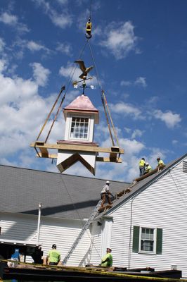 Plumb Library
A new cupola complete with a copper covered roof and refurbished bronze and copper eagle weathervane now graces the roof of the Plumb Library in Rochester center. Old Colony Regional Vocational Technical High School carpentry shop students in partnership with Diversified Roofing Systems, New Bedford, owned by Richard Miranda, built the new cupola for the town. Rochester’s facility manager Andrew Daniel spearheaded the project and brought together the school and business partners. Photo by Marilou Newell
