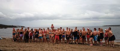 Christmas Day Swim
On Christmas Day 2014, about 50 hardy souls, young and old alike, ran with yelps of joy into 42-degree winter waters at Mattapoisett’s Town Beach. This annual event raises funds for Helping Hands and Hooves, a nonprofit organization in Mattapoisett that provides horseback riding lessons and therapeutic sessions for people with special needs. Photos by Marilou Newell
