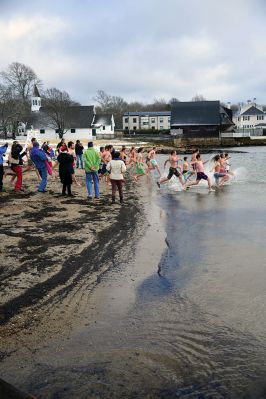 Christmas Day Swim
The Helping Hands and Hooves’ annual Christmas Day Swim was preceded by a polar plunge in the weather and a brief ‘snownado’ of sorts as the winds swept snow and sleet across the area only minutes before enthusiastic participants in costume arrived at the Mattapoisett Town Beach and raced into the icy waters. Photos by Glenn C. Silva
