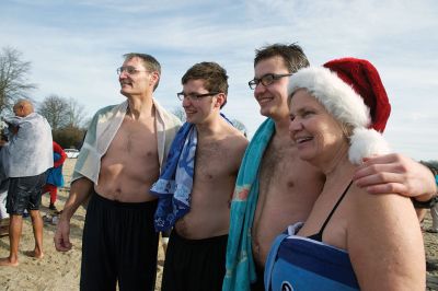 14th Annual Christmas Day Swim
The Helping Hands and Hooves 14th Annual Christmas Day Swim got a helping hand from the unseasonably warm weather, drawing in roughly 80 participants who took the polar plunge to support the organization’s therapeutic horseback riding program for adults with special needs. Photos by Colin Veitch
