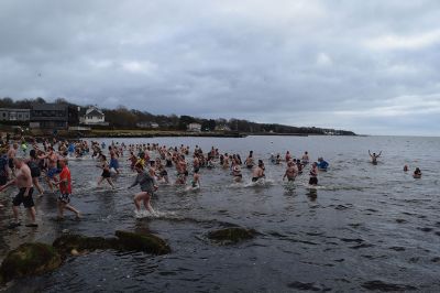 Polar Plunge
On New Years Day, hundreds were arrayed at Mattapoisett Town Beach for this year’s Mattapoisett Polar Plunge. Since 2013, the beach has seen residents and visitors run into the freezing Atlantic to kick off the new year. The event is held by Keep On Plungin’ who, through the selling of baked goods, coffee, and hot chocolate, donate all proceeds of the fridged plunge to local families grappling with the costs of cancer treatment. Photo by Sam Bishop.
