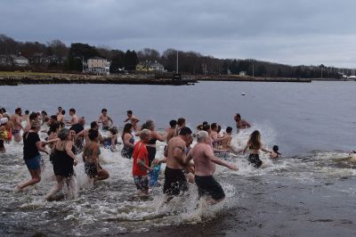 Polar Plunge
On New Years Day, hundreds were arrayed at Mattapoisett Town Beach for this year’s Mattapoisett Polar Plunge. Since 2013, the beach has seen residents and visitors run into the freezing Atlantic to kick off the new year. The event is held by Keep On Plungin’ who, through the selling of baked goods, coffee, and hot chocolate, donate all proceeds of the fridged plunge to local families grappling with the costs of cancer treatment. Photo by Sam Bishop.
