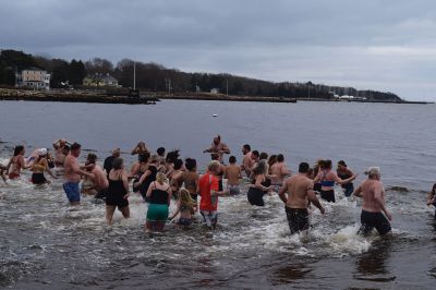 Polar Plunge
On New Years Day, hundreds were arrayed at Mattapoisett Town Beach for this year’s Mattapoisett Polar Plunge. Since 2013, the beach has seen residents and visitors run into the freezing Atlantic to kick off the new year. The event is held by Keep On Plungin’ who, through the selling of baked goods, coffee, and hot chocolate, donate all proceeds of the fridged plunge to local families grappling with the costs of cancer treatment. Photo by Sam Bishop.
