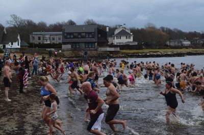 Polar Plunge
On New Years Day, hundreds were arrayed at Mattapoisett Town Beach for this year’s Mattapoisett Polar Plunge. Since 2013, the beach has seen residents and visitors run into the freezing Atlantic to kick off the new year. The event is held by Keep On Plungin’ who, through the selling of baked goods, coffee, and hot chocolate, donate all proceeds of the fridged plunge to local families grappling with the costs of cancer treatment. Photo by Sam Bishop.
