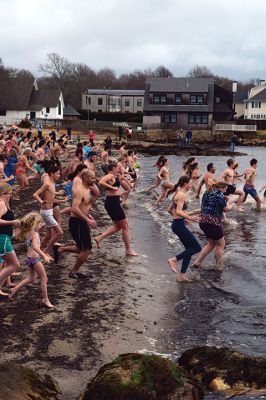 Polar Plunge
On New Years Day, hundreds were arrayed at Mattapoisett Town Beach for this year’s Mattapoisett Polar Plunge. Since 2013, the beach has seen residents and visitors run into the freezing Atlantic to kick off the new year. The event is held by Keep On Plungin’ who, through the selling of baked goods, coffee, and hot chocolate, donate all proceeds of the fridged plunge to local families grappling with the costs of cancer treatment. Photo by Sam Bishop. January 9, 2025 edition
