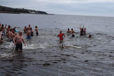 Polar Plunge
On New Years Day, hundreds were arrayed at Mattapoisett Town Beach for this year’s Mattapoisett Polar Plunge. Since 2013, the beach has seen residents and visitors run into the freezing Atlantic to kick off the new year. The event is held by Keep On Plungin’ who, through the selling of baked goods, coffee, and hot chocolate, donate all proceeds of the fridged plunge to local families grappling with the costs of cancer treatment. Photo by Sam Bishop.
