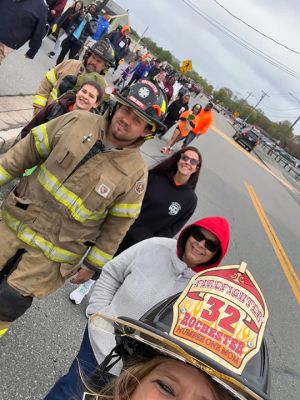 Rochester Fire Department
Members of the Rochester Fire Department participated in full gear for Saturday’s, 3-mile Team Hero's Walk held at Fort Taber in New Bedford. In the department’s 10th year walking, the participants raised $8,500, the largest amount raised to date as they symbolized the extra weight of living with Multiple Sclerosis. In 2014, Deputy Fire Chief and Highway Surveyor Jeff Eldridge was diagnosed with MS after experiencing the pain of trigeminal neuralgia, a condition he continues to battle while serving the Town
