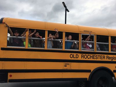 Sayonara, School! 
Dark clouds and raindrops couldn’t dampen the spirits of students and teachers on June 25 when Rochester Memorial School said farewell until next September. Bandleader Chris Williamson, along with teachers and Principal Derek Medeiros, sent the students on their way with the traditional rousing music. The musical fest-like last day of school has been taking place for more then 20 years, according to Williamson. Photos by Marilou Newell
