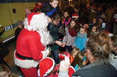 Rochester Christmas Tree Lighting
Rochester held its annual tree lighting on Monday night, December 7, in front of the Town Hall. Hundreds attended and greeted jolly old Saint Nick as he rode in on the town’s new yellow fire tower truck. RMS students in the band and chorus sang Christmas carols and guests enjoyed complimentary cider and cocoa inside Town Hall afterwards. Photos by Colin Veitch
