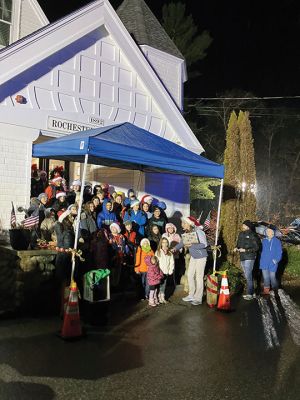 Annual Tree Lighting
Rochester Memorial School students singing Christmas songs under a blue canopy at the Rochester Town Hall. Photo by Mike Decicco.
