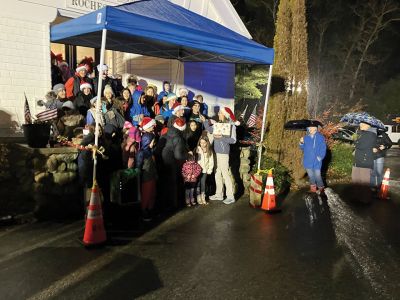 Annual Tree Lighting
Rochester Memorial School students singing Christmas songs under a blue canopy at the Rochester Town Hall. Photo by Mike Decicco.
