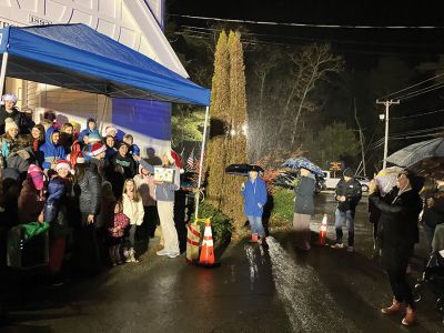 Annual Tree Lighting
Rochester Memorial School students singing Christmas songs under a blue canopy at the Rochester Town Hall. Photo by Mike Decicco.
