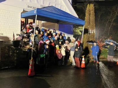 Annual Tree Lighting
Rochester Memorial School students singing Christmas songs under a blue canopy at the Rochester Town Hall. Photo by Mike Decicco.
