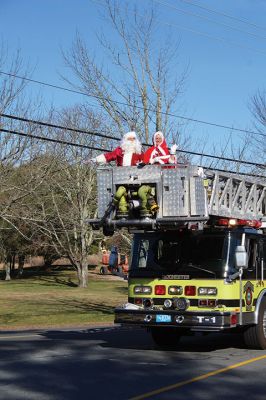 Mr. and Mrs. Santa Claus
Mr. and Mrs. Santa Claus make their turn through Rochester Village onto New Bedford Road on December 5. Transported by the Rochester Fire Department on a journey that began at Fire Station No. 3 at 200 Ryder Road and accompanied by Santa’s helpers riding along in trucks, Mr. and Mrs. Claus made their way down many Rochester roads, spending hours to visit hundreds of children waiting at the end of their driveways and on street corners. A Google map device tracked Santa’s whereabouts throughout the ride. Phot
