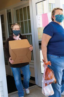 Rochester Council on Aging 
Rochester Council on Aging Director Cheryl Randall-Mach, Lorraine Thompson and a volunteer distribute meals at the COA. Photo by Kelly Smith
