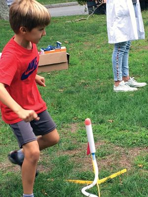 Rockets
Mattapoisett Library hosted Dr. Sandra Pearl of SEED Education on September 21. SEED is a regional, nonprofit organization run by Ph.D. scientists with a passion for empowering teachers with the confidence to instill a love of science in their students. Pearl led a group of eager students through science experiments geared to launching things into the air. There was age-appropriate physics, chemistry and just plain fun. The activity was made possible through a grant from the Mattapoisett Cultural Council. 
