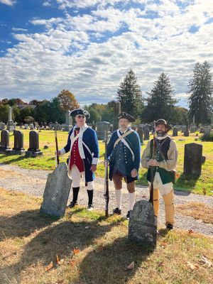 Sons of The American Revolution
Under a glorious blue and white sky, people came together at Rochester’s Center Ceremony on October 26 to memorialize a revolutionary patriot, Thomas Bassett. The ceremony was led by the Cape and Islands Chapter of the Sons of The American Revolution. Connie Eshbach, Chairman of the Rochester Historical Commission, was the keynote speaker and spoke of Bassett’s service during the war. “Thomas Bassett served as a private under Captain Stephen Wing on Dorchester Heights in March 1776. He also served as a seam
