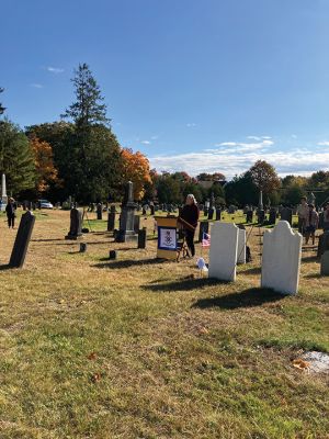 Sons of The American Revolution
Under a glorious blue and white sky, people came together at Rochester’s Center Ceremony on October 26 to memorialize a revolutionary patriot, Thomas Bassett. The ceremony was led by the Cape and Islands Chapter of the Sons of The American Revolution. Connie Eshbach, Chairman of the Rochester Historical Commission, was the keynote speaker and spoke of Bassett’s service during the war. “Thomas Bassett served as a private under Captain Stephen Wing on Dorchester Heights in March 1776. He also served as a seam
