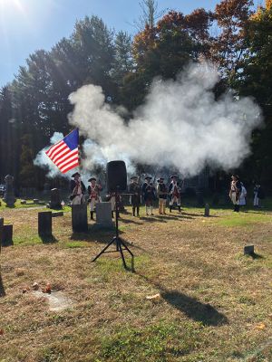 Sons of The American Revolution
Under a glorious blue and white sky, people came together at Rochester’s Center Ceremony on October 26 to memorialize a revolutionary patriot, Thomas Bassett. The ceremony was led by the Cape and Islands Chapter of the Sons of The American Revolution. Connie Eshbach, Chairman of the Rochester Historical Commission, was the keynote speaker and spoke of Bassett’s service during the war. “Thomas Bassett served as a private under Captain Stephen Wing on Dorchester Heights in March 1776. He also served as a seam
