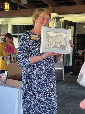 Sippican Woman's Club
Outgoing President of the Sippican Woman's Club, Kathy Tibbetts displaying a framed picture of the Club's clubhouse a/k/a "Handy's Tavern", 152 Front Street, Marion.  The picture is a gift of appreciation from the membership for Kathy's guidance and support in serving as the club's President for the past two terms.  Priscilla Bradley was elected President at the Club's Annual Meeting held on April 26, 2024 at The Bay Club. Photo courtesy Deborah Bush
