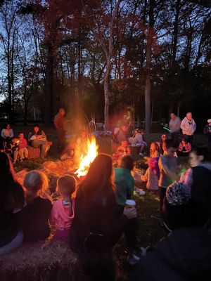 Salty Soirée
Since 2007, the Mattapoisett Land Trust has invited the community to a soirée at the site of Salty the Seahorse. The Halloween themed party on October 19 featured musical performances by Jeff and Lisa Dunn, storytelling by the campfire with Karen Chace, and make-your-own s’mores. The entrance to the park at the corner of Route 6 and North Street was lined with luminarias decorated by Center School students. First introduced by MLT member Don Cuddy. Photos by Marilou Newell
