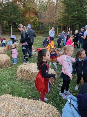 Salty Soirée
Since 2007, the Mattapoisett Land Trust has invited the community to a soirée at the site of Salty the Seahorse. The Halloween themed party on October 19 featured musical performances by Jeff and Lisa Dunn, storytelling by the campfire with Karen Chace, and make-your-own s’mores. The entrance to the park at the corner of Route 6 and North Street was lined with luminarias decorated by Center School students. First introduced by MLT member Don Cuddy. Photos by Marilou Newell
