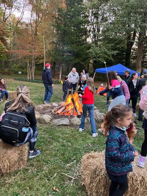 Salty Soirée
Since 2007, the Mattapoisett Land Trust has invited the community to a soirée at the site of Salty the Seahorse. The Halloween themed party on October 19 featured musical performances by Jeff and Lisa Dunn, storytelling by the campfire with Karen Chace, and make-your-own s’mores. The entrance to the park at the corner of Route 6 and North Street was lined with luminarias decorated by Center School students. First introduced by MLT member Don Cuddy. Photos by Marilou Newell
