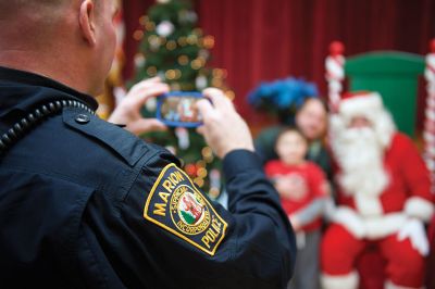 Pizza with Santa
The Marion Police Brotherhood held its 5th annual Pizza with Santa on Sunday, December 4, at the Marion Music Hall. Kids shared a pie with jolly old Saint Nick and later posed for pictures. Photos by Colin Veitch
