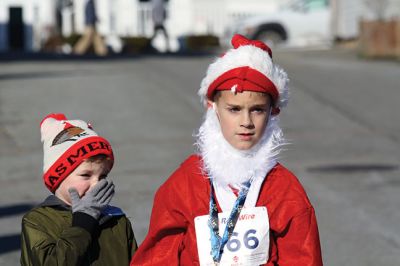 Santa Run 
Saturday, December 7, was the Santa Run 5k through the village of Mattapoisett. Usually held in New Bedford, race organizer Geoff Smith moved the race to Mattapoisett, flooding the village streets with hundreds of Santas – and a few Christmas miniature horses, as well. Photos by Jean Perry
