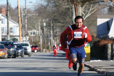 Santa Run 
Saturday, December 7, was the Santa Run 5k through the village of Mattapoisett. Usually held in New Bedford, race organizer Geoff Smith moved the race to Mattapoisett, flooding the village streets with hundreds of Santas – and a few Christmas miniature horses, as well. Photos by Jean Perry
