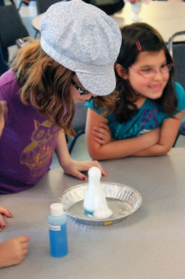 Mad Scientist
 The Joseph H. Plumb Library in Rochester kicked off their summer reading program entitled “Dig Into Reading” last Friday evening at the Congressional Church, where “Mad Scientist” Laser Leigh presented a group of K-6 graders from the Tri-Town area with several scientific experiments and an informative-yet-fun lecture on the wide scientific world. Photos by Nick Walecka. 
