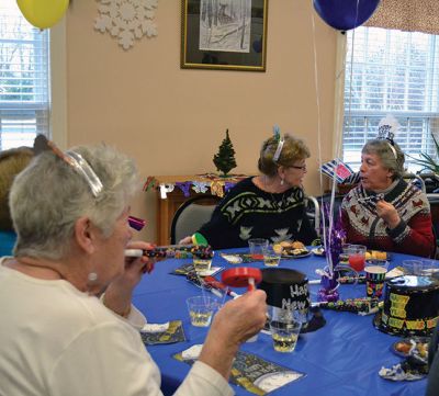 Noon Year’s Eve
The year 2014 arrived a little early on Tuesday afternoon for the guests at the Senior Center’s Annual New Year’s Eve party. It was a “Noon Year’s Eve” party of sorts, with more than enough shiny hats and tiaras, colorful noisemakers, bright balloons, and champagne to go around. Photo by Jean Perry
