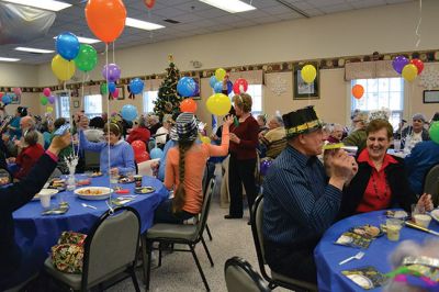 Noon Year’s Eve
The year 2014 arrived a little early on Tuesday afternoon for the guests at the Senior Center’s Annual New Year’s Eve party. It was a “Noon Year’s Eve” party of sorts, with more than enough shiny hats and tiaras, colorful noisemakers, bright balloons, and champagne to go around. Photo by Jean Perry
