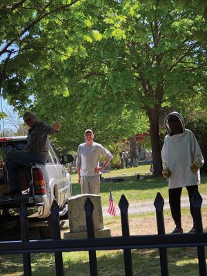 Hive Move
Bob and Bill Field and Sue Wilbur help assist a swarm to the hive (in a truck) on Sunday in the cemetery near Sue's grandma’s grave. Photo by Jennifer F. Shepley
