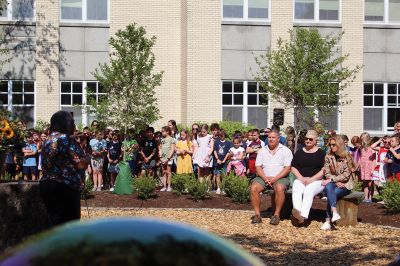 Children’s Memorial Garden
Where for many years stood a tall spruce tree at Sippican Elementary School is now a large stump at the center of a newly dedicated Children’s Memorial Garden honoring the lives of former students Marques Sylvia, Andrew Rego, Alexis Wisner and Cory Jackson. On June 14, Principal Marla Sirois led a celebration of the vision of former Principal Marylou Hobson (1990-2004) and the generosity and effort of Steve Gonsalves, Suzanna Davis, Margie Baldwin and the Pythagorean Lodge. Photos by Mick Colageo
