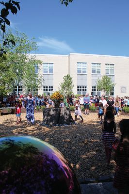 Children’s Memorial Garden
Where for many years stood a tall spruce tree at Sippican Elementary School is now a large stump at the center of a newly dedicated Children’s Memorial Garden honoring the lives of former students Marques Sylvia, Andrew Rego, Alexis Wisner and Cory Jackson. On June 14, Principal Marla Sirois led a celebration of the vision of former Principal Marylou Hobson (1990-2004) and the generosity and effort of Steve Gonsalves, Suzanna Davis, Margie Baldwin and the Pythagorean Lodge. Photos by Mick Colageo
