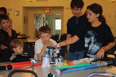 Star Wars Fans
Local young Star Wars fans gathered in Rochester at the Congregational Church on July 18 for a Star Wars symposium, hosted by Star Wars expert Peter Struzziero and sponsored by the Plumb Library. Pictured in descending order left to right: Dylan Hathaway, Bridget Farias, Ryan Farias, Andrew Ronsky, Molly Ronsky, Jack Ronsky, Nicholas Miedemar, and Rebecca York. Photo by Jean Perry
