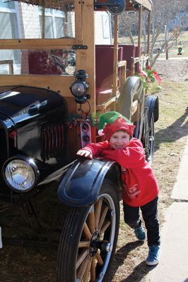 Stuff a Cruiser
Willie enjoys a moment with the 1924 Model T, and Santa Claus is joined by Marion Chief of Police Richard Nighelli and his daughter Kayla as the Marion Police Department and Marion Police Brotherhood collaborated for their annual Stuff a Cruiser event at the Sippican Elementary School’s bus loop. 
