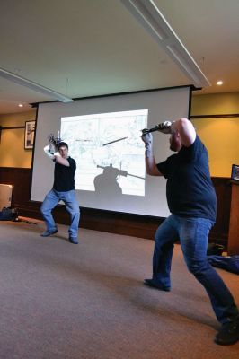 Cold Steel
“Cold Steel” was one of the educating and exciting free programs the Mattapoisett Free Library offers during the summer. Visitors learned all about the history of swords and the origins of sword fighting, while Jeff Lord and Jeff Goodkind from the Association for Renaissance and Medieval Swordsmanship gave live demonstrations before a crowd of enthusiastic kids and adults. Photos by Jean Perry
