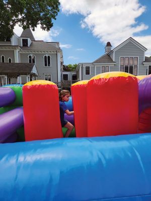 Summer Kick-Off Block Part
A giant, inflatable obstacle course beckoned children in pursuit of their school vacation during Saturday’s 2024 Summer Kick-Off Block Party held by the Elizabeth Taber Library. The event included face painting and crafts, ice cream and a giant slide back down from the top. Photo by Mick Colageo - June 20, 204 edition
