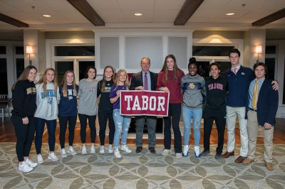  Tabor Academy
Eleven Tabor Academy seniors signed National Letters of Intent on November 14 to play Division 1 athletics next year. Four played on championship teams last year, helping to capture the first of Tabor Academy’s ISL Championships in Girls’ Basketball and Girls’ Hockey. Pictured L-R: Nicole Gallagher, Tali O’Leary, Annie Berry, Lauren Marandett, Maggie Adams, Lucy Hauck, Head of School John Quirk, Faye Parker, Nirel Lougbo, Aly Hussein, Clendenin Stewart, and Brian Wiles. Photo courtesy Tabor Academy
