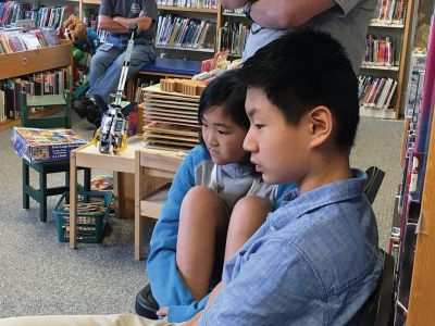 Robots
Old Colony student Bridgett Farias of Rochester demonstrates how a robot works during an introductory meeting sponsored by Plumb Library on May 17. Students in Grades 4 through 6 got to drive robots and learn more about the high school program. Photo by Marilou Newell
