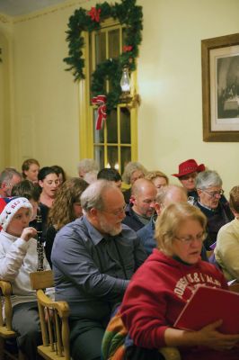 Tinkhamtown Chapel
The annual Christmas carol sing-along at the Tinkhamtown Chapel was as popular and beautiful as ever on the chilly evening of December 20, when dozens of people followed the glow of candlelit windows to the tiny chapel to sing with their families and neighbors and welcome Christmas to Mattapoisett. Photos by Colin Veitch
